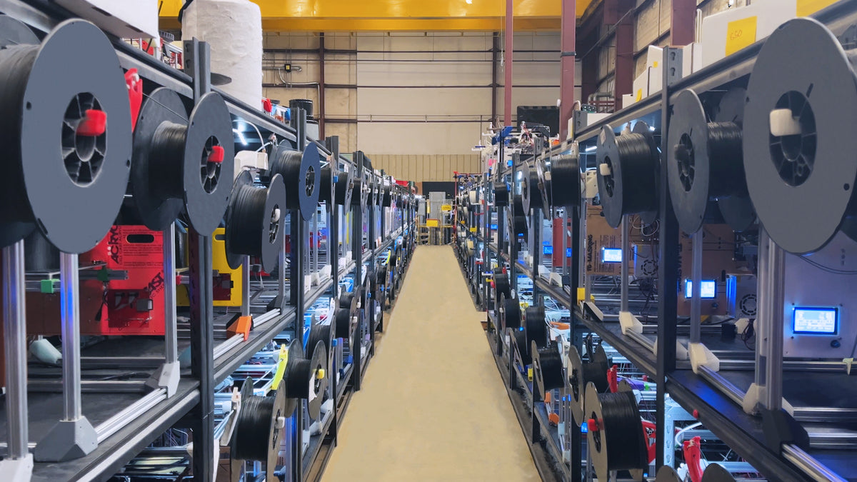 Long aisle in a warehouse with shelves stocked with equipment
Slant-3D-Print-Farm, Slant3D, https://www.tctmagazine.com/slant-3d-launches-shopify-plug-in/